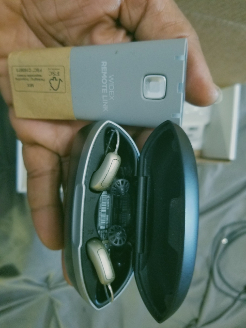 Widex Gold Behind-the-Ear Hearing Aids with Black Charging Case